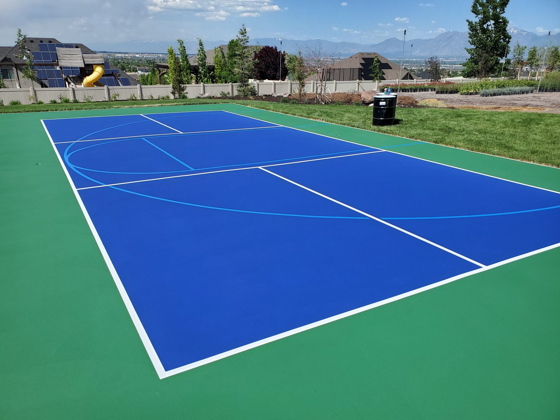 Blue basketball court with panoramic Salt Lake valley view
